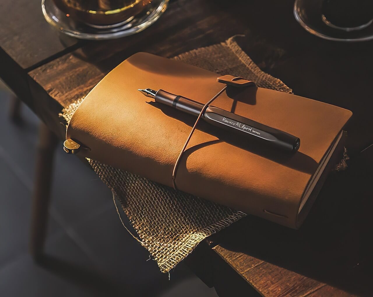 photo of a notebook and pen on a table, photo by Phuong Luu from Pixabay