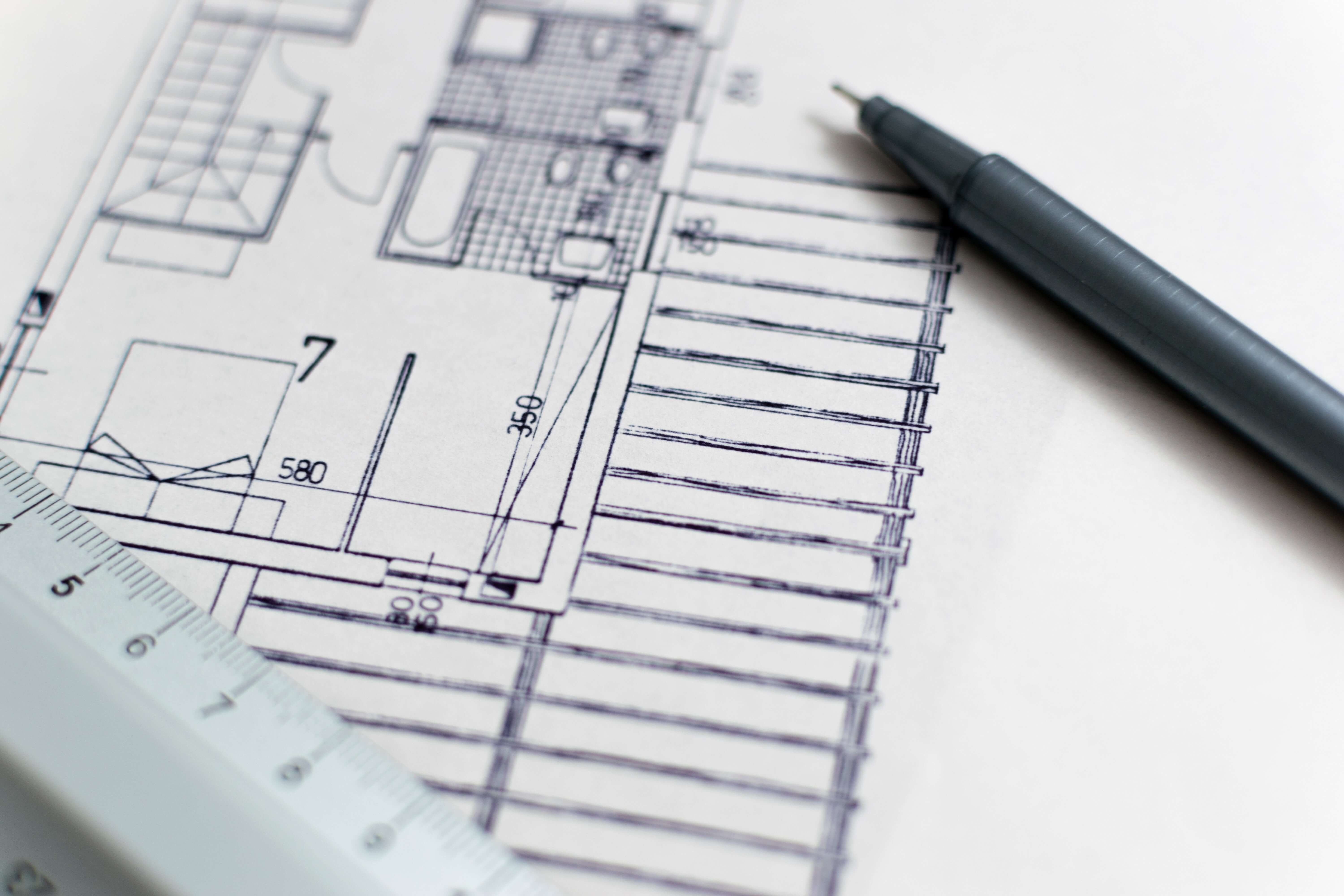 Image from Pixaby of residential floorplan blueprint, pen, and ruler